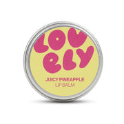 Hand holding the Juicy Pineapple lip balm tin