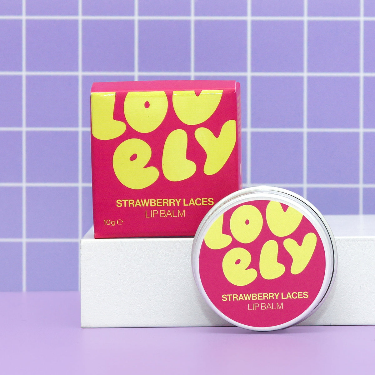 Strawberry Laces lip balm tin and box by Lovely Skincare styled lifestyle view