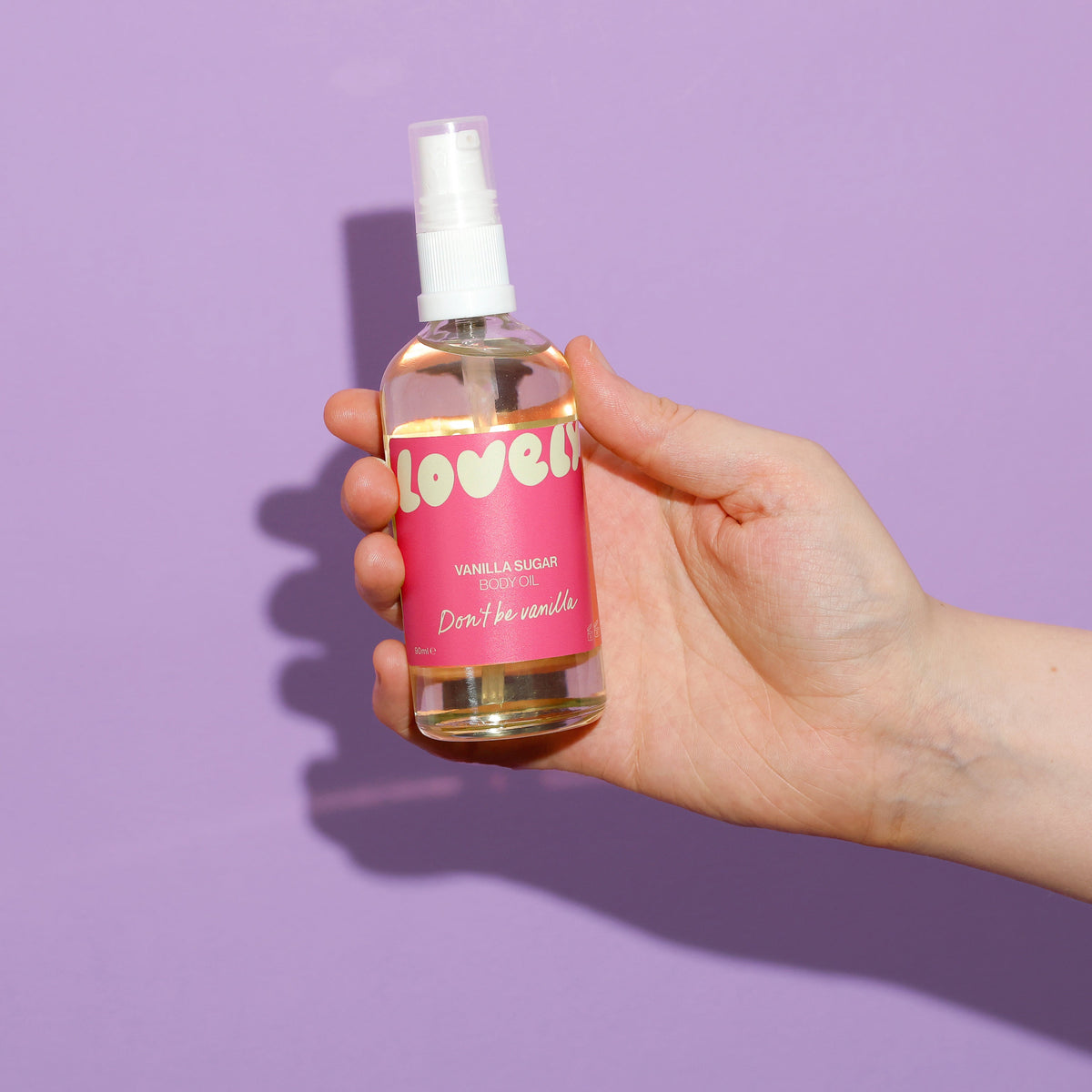 Hand holding the Vanilla Sugar body oil