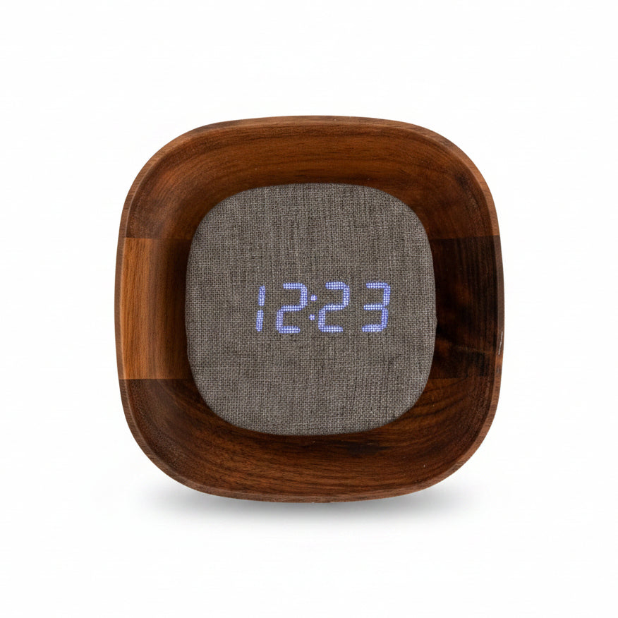 Hands holding square walnut Lumos clock with display