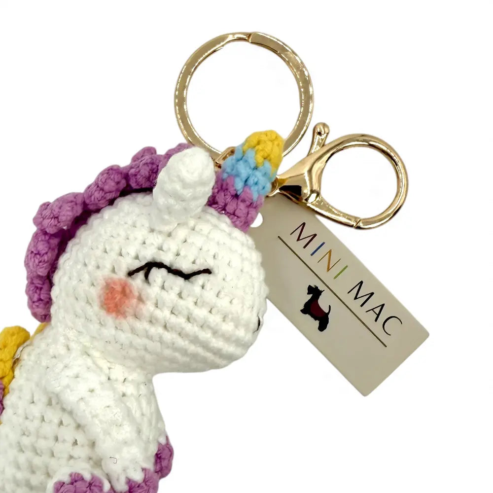 Crochet unicorn keychain seen from another angle showing the clip fitting