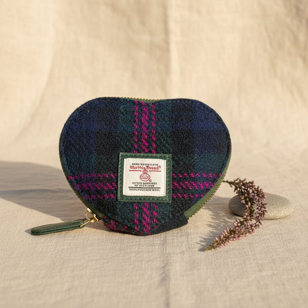 Heart-shaped Harris Tweed coin purse with a visible brand label on a white background