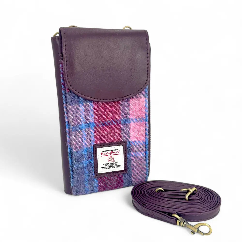 Pastel Pink Harris Tweed phone purse with plum flap and crossbody strap on white background