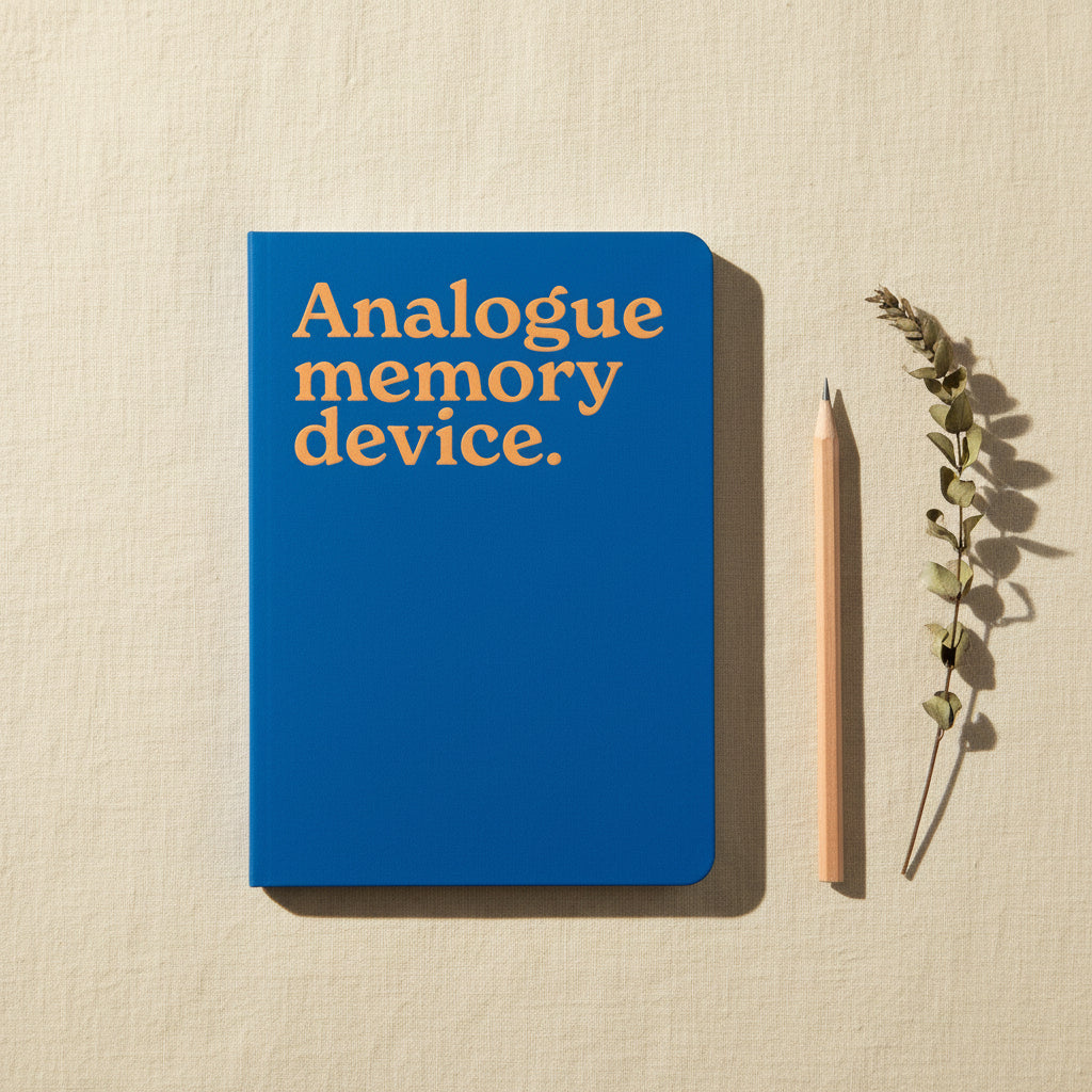 Analogue Memory Device neon A5 notebook shown flat on a white background