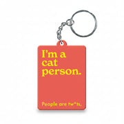 Cat person slogan keyring in coral on white background