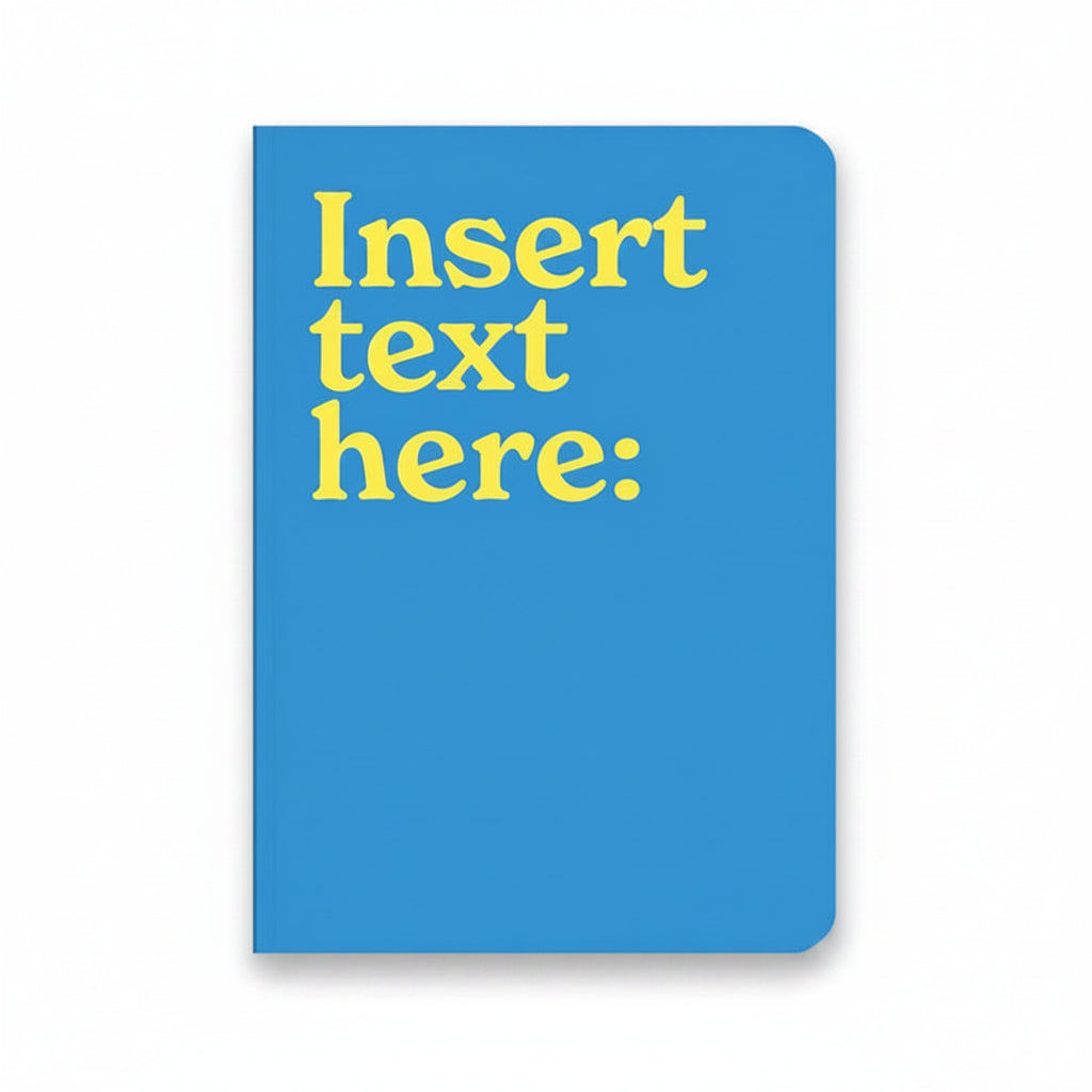 Insert Text Here A5 notebook with blue cover and white lettering