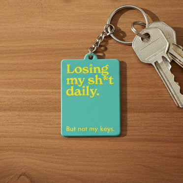 Mint Publishing 'Losing My Sh*t Daily' green keyring with yellow text