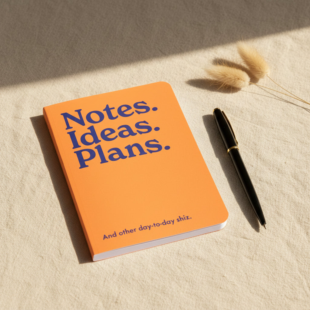 Notes Ideas Plans neon A5 notebook shown flat on a white background