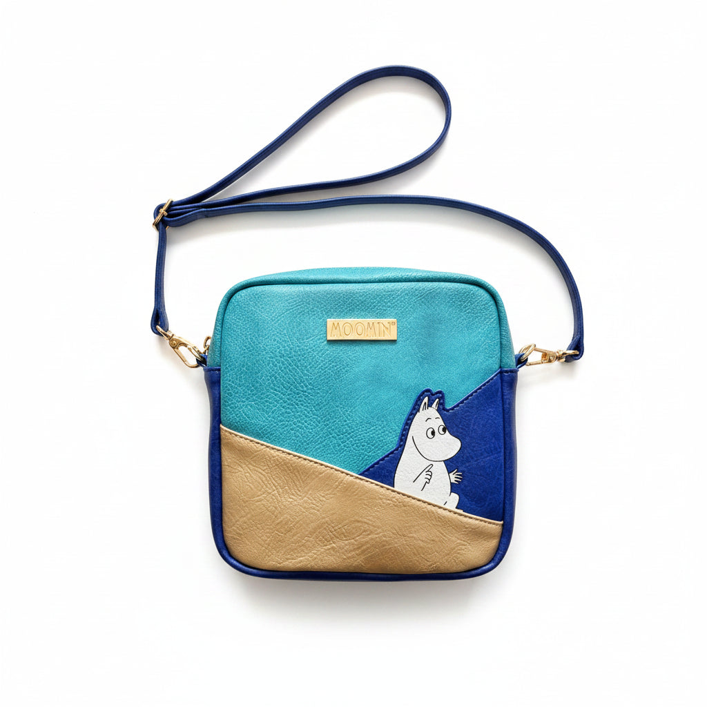Moomin Gold Mini Bag flat lay showing front design with Moomin motif and gold logo plate.
