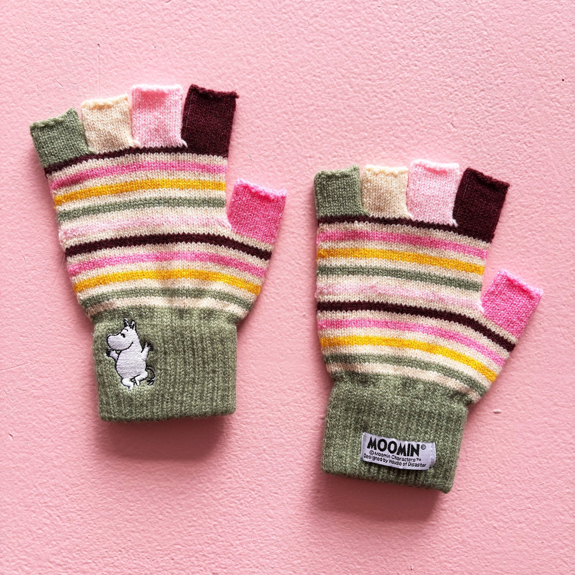 Back view of Moomin Stripy Fingerless Gloves showing colourful stripes and Moomin label.
