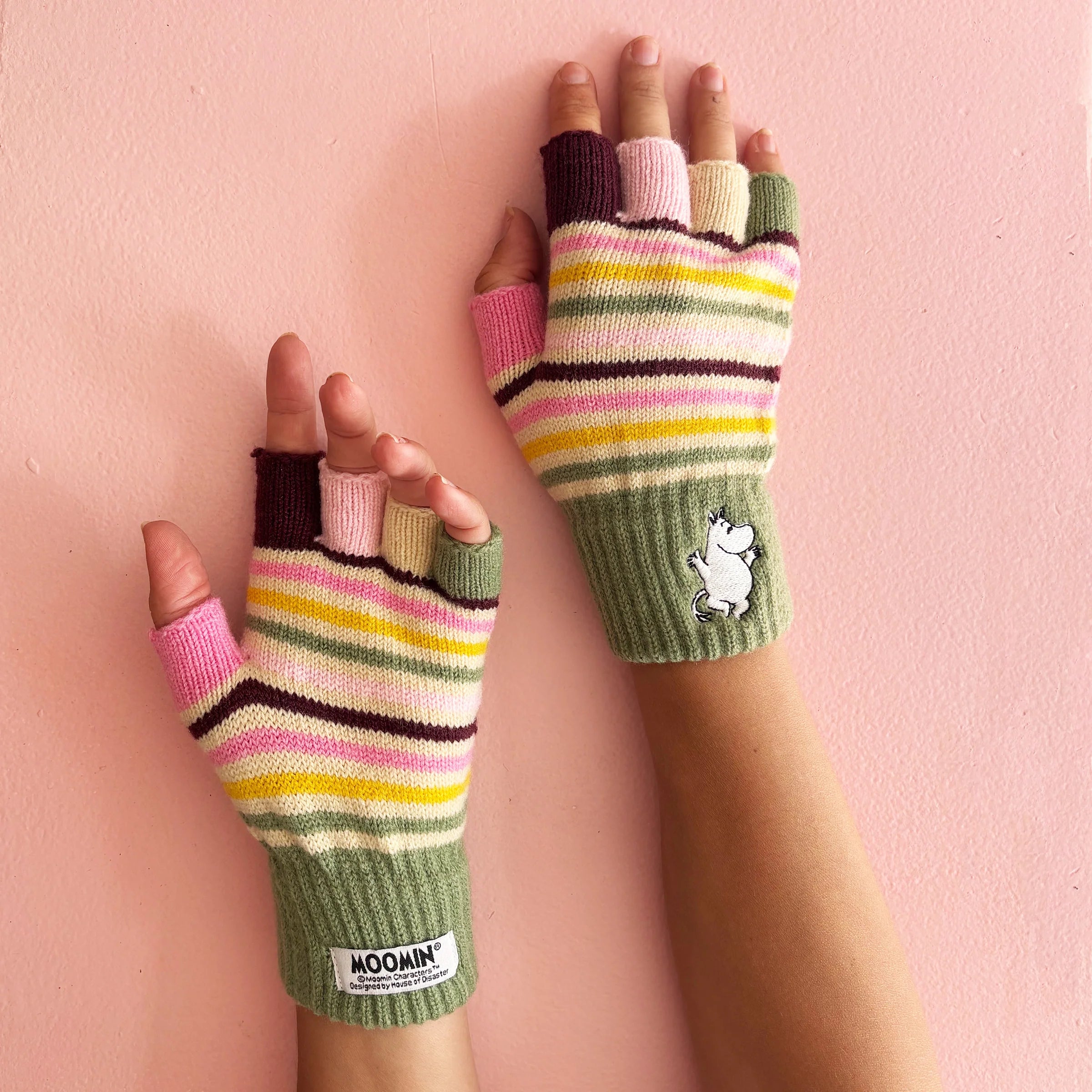Close-up of Moomin Stripy Fingerless Gloves showing embroidered detail and ribbed cuff.
