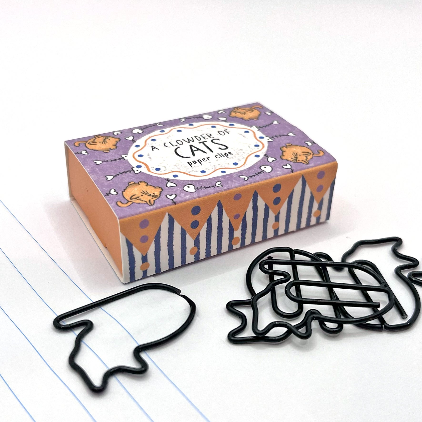 Close-up of the black cat shaped wire paper clips