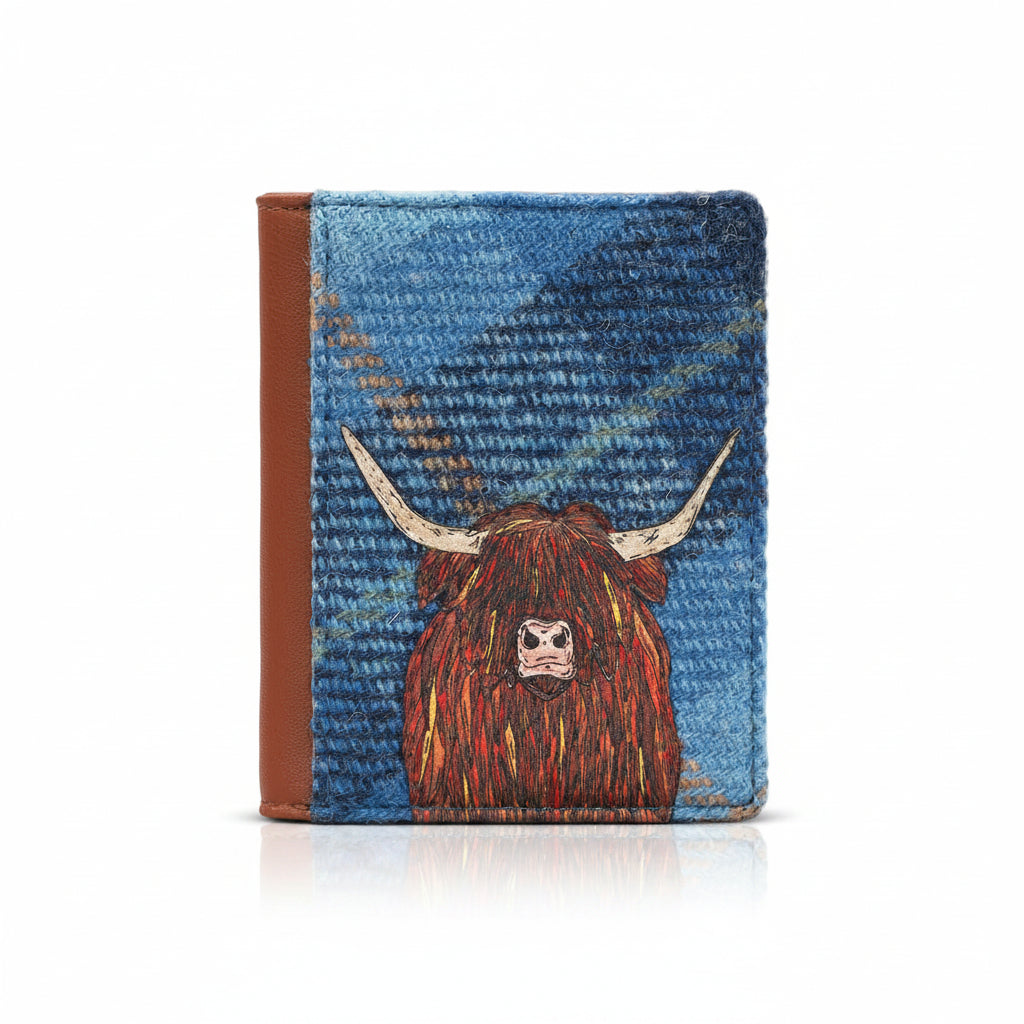 Highland cow flap-over card holder in blue tweed-effect vegan leather, front view on grey