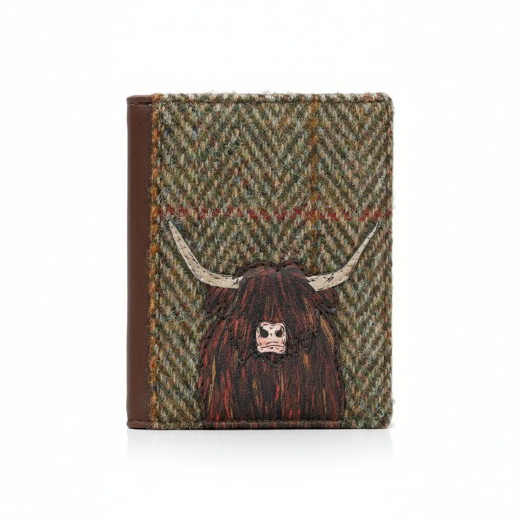 Highland cow flap-over card holder in green tweed-effect vegan leather, front view on grey
