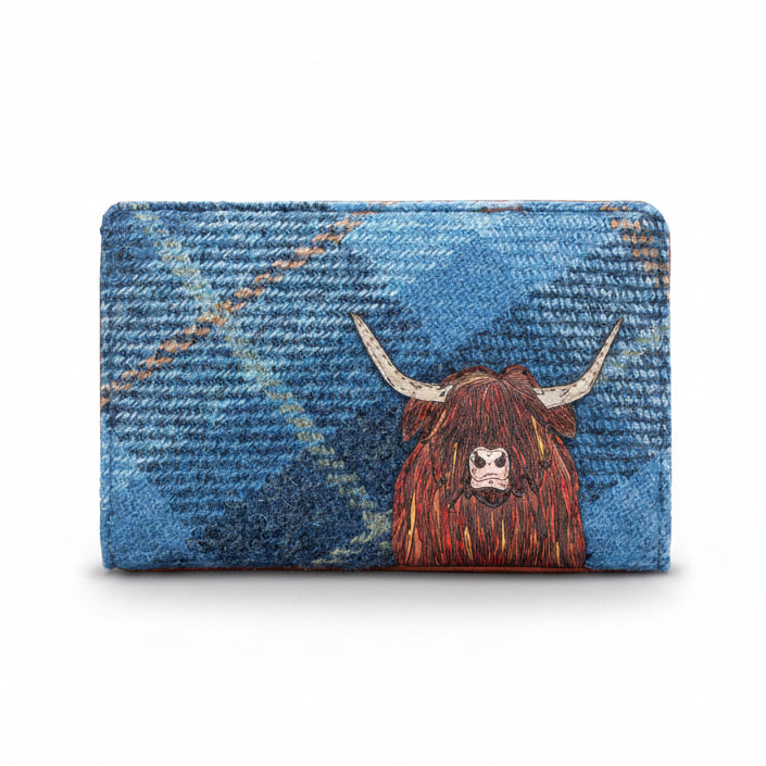Highland cow flap-over purse in blue tweed-effect vegan leather, front view on grey