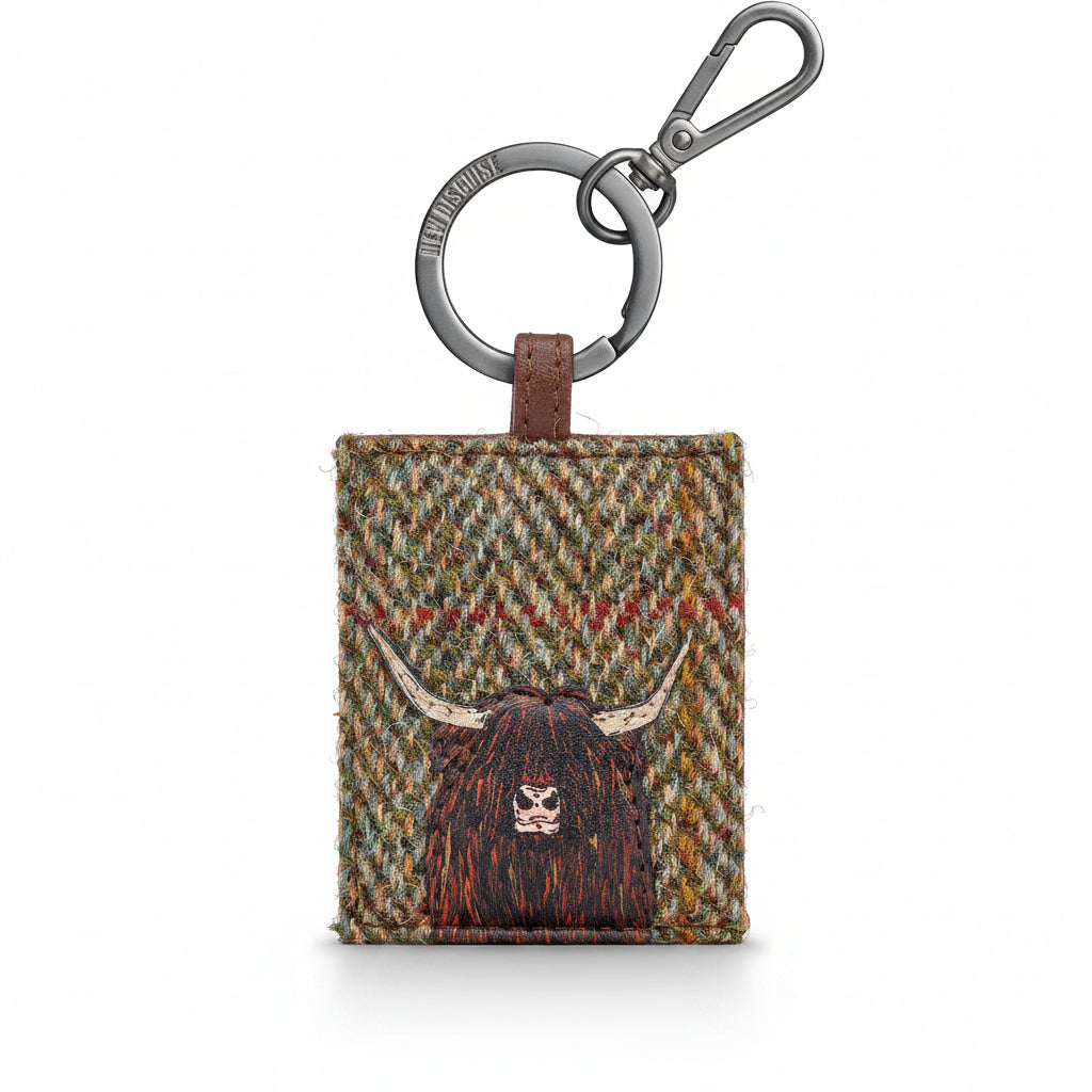 Highland cow keyring in green tweed-effect vegan leather, front view on grey