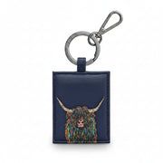 Navy leather key fob with a colorful highland cow design on a white background