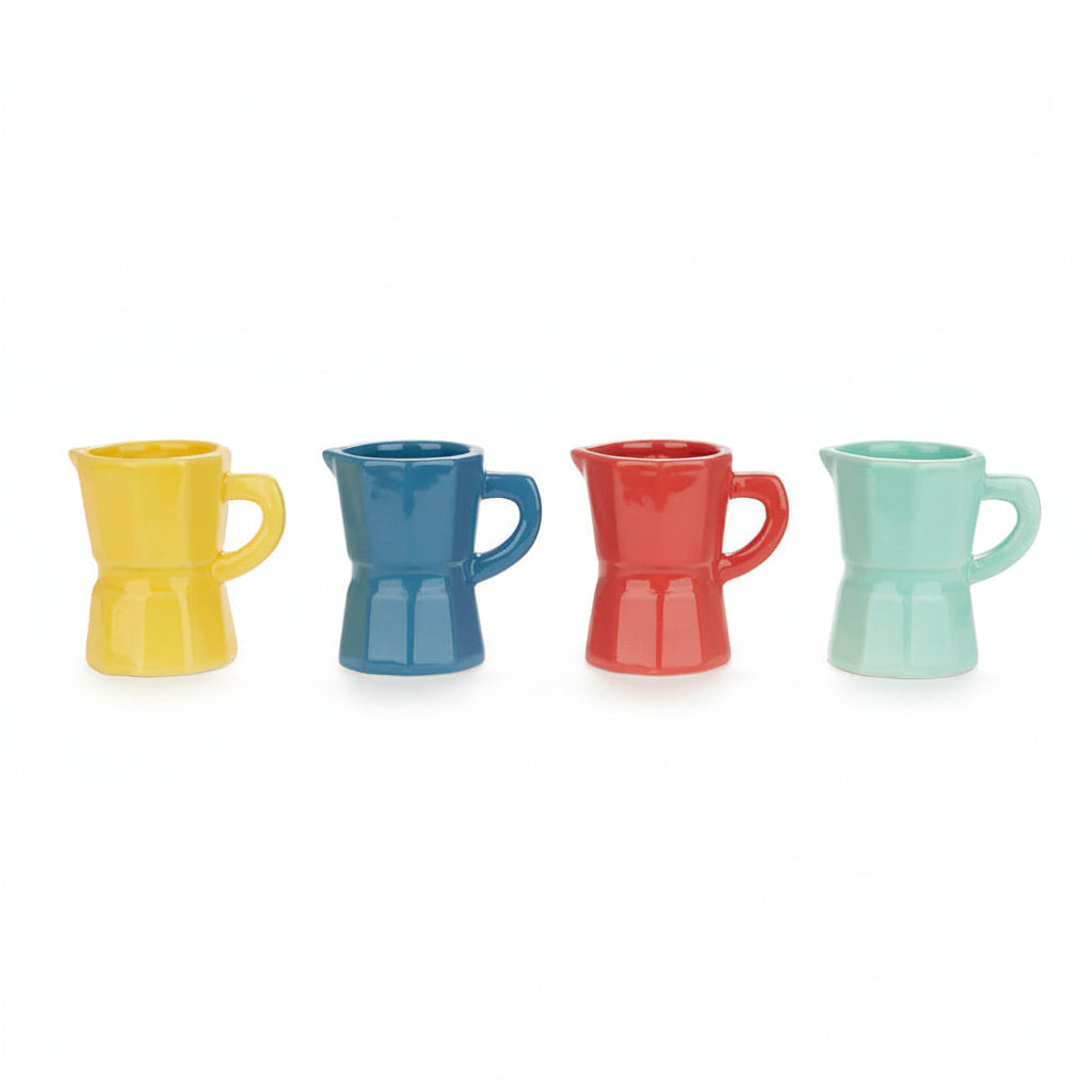 Four multicolour ceramic espresso cups arranged in a row