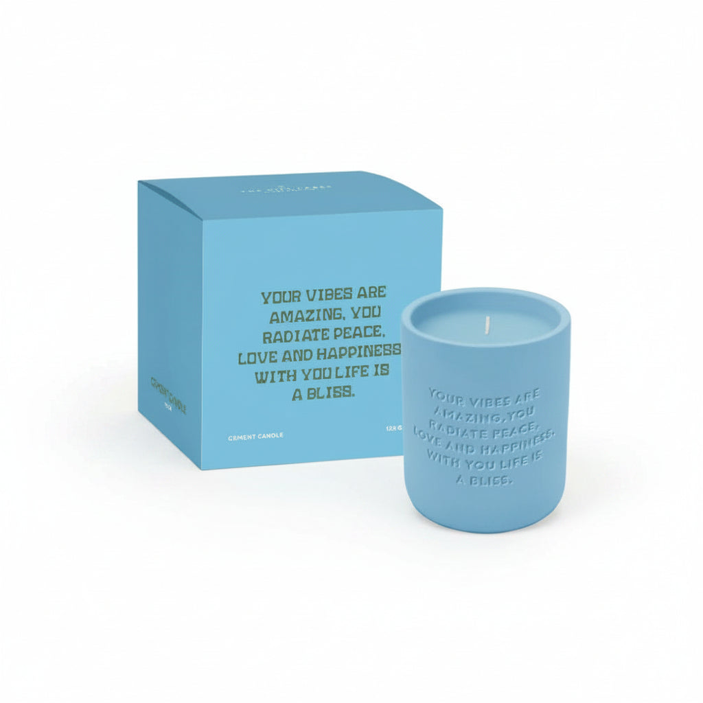 Blue cement candle with matching blue gift box on white