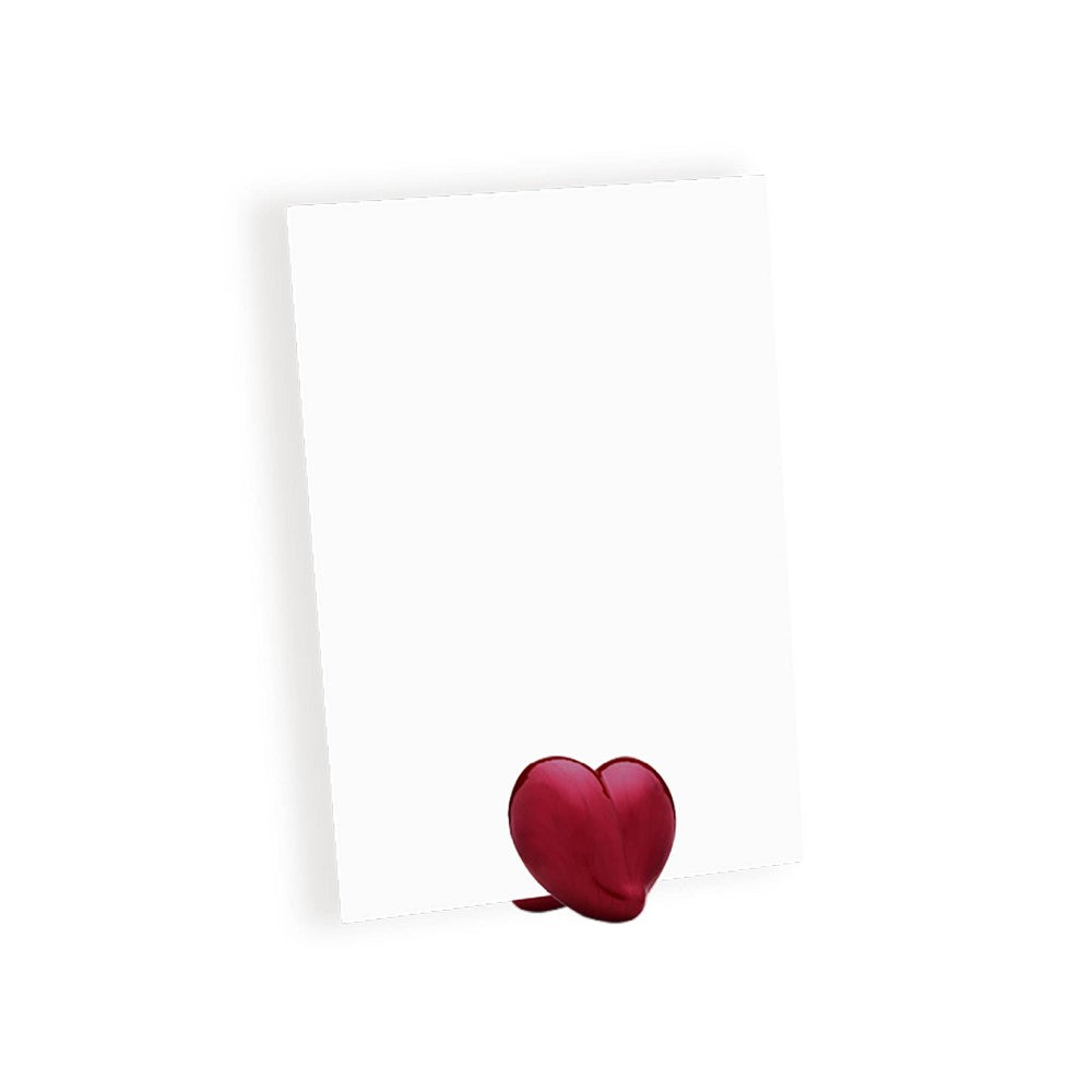 Heart-shaped ceramic with white card on white background