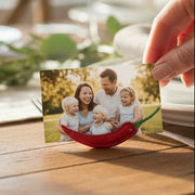 Red pepper photo holder on white background with white card