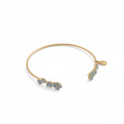 Open gold-plated forget-me-not bangle with blue enamel floral detailing