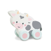 Wooden cow push toy on a pure white background
