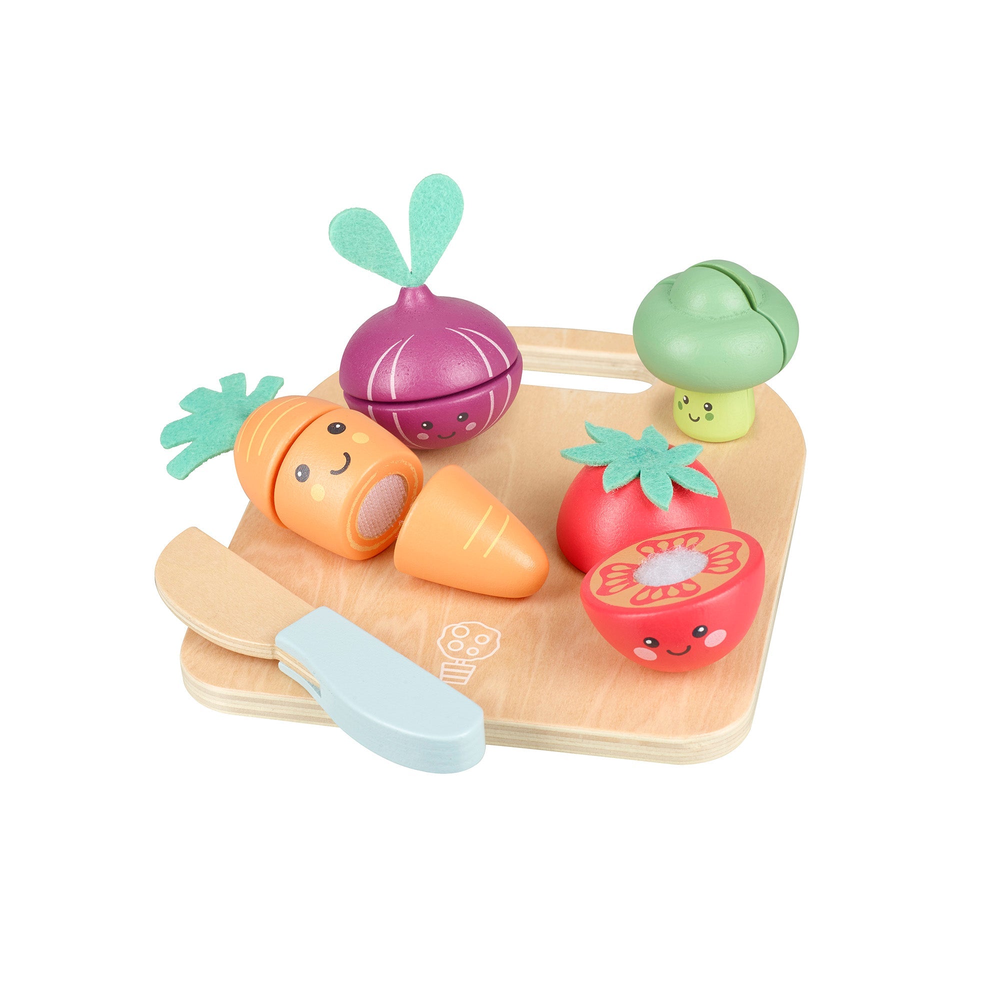 Wooden cutting vegetables arranged on their board seen from another angle