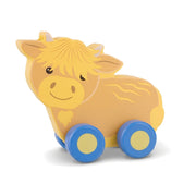 Highland cow wooden push toy on a pure white background