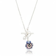 Silver toggle necklace with pansy and pearl charms close-up
