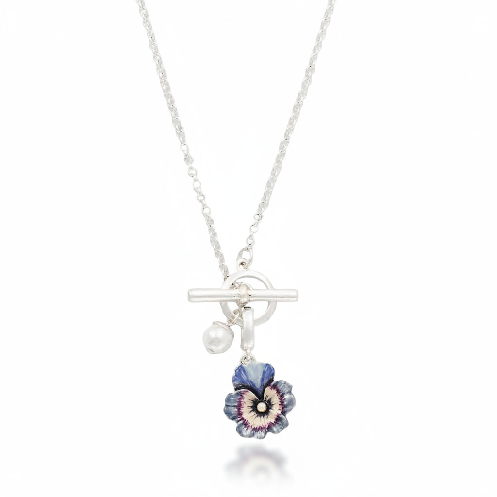 Silver toggle necklace with pansy and pearl charms close-up