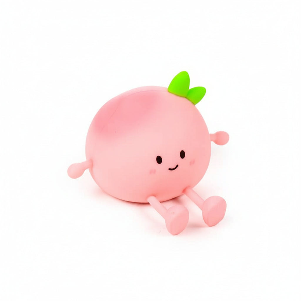 Pink silicone Peach Sleep Lamp switched off on white background.