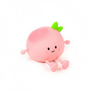 Pink silicone Peach Sleep Lamp switched off on white background.