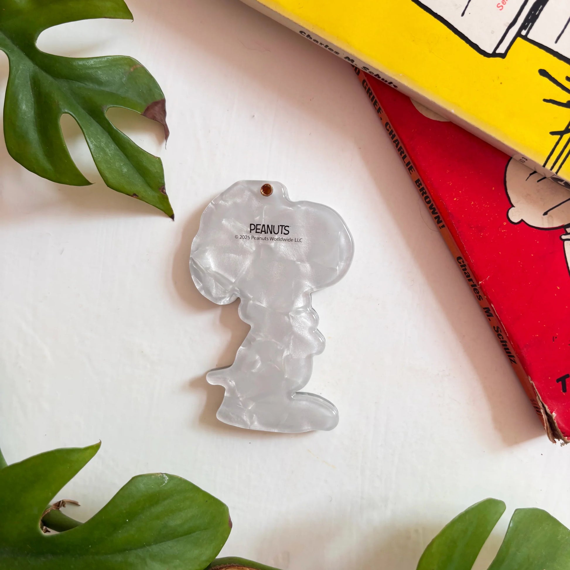 Back of Peanuts compact mirror in pearlescent acetate finish.