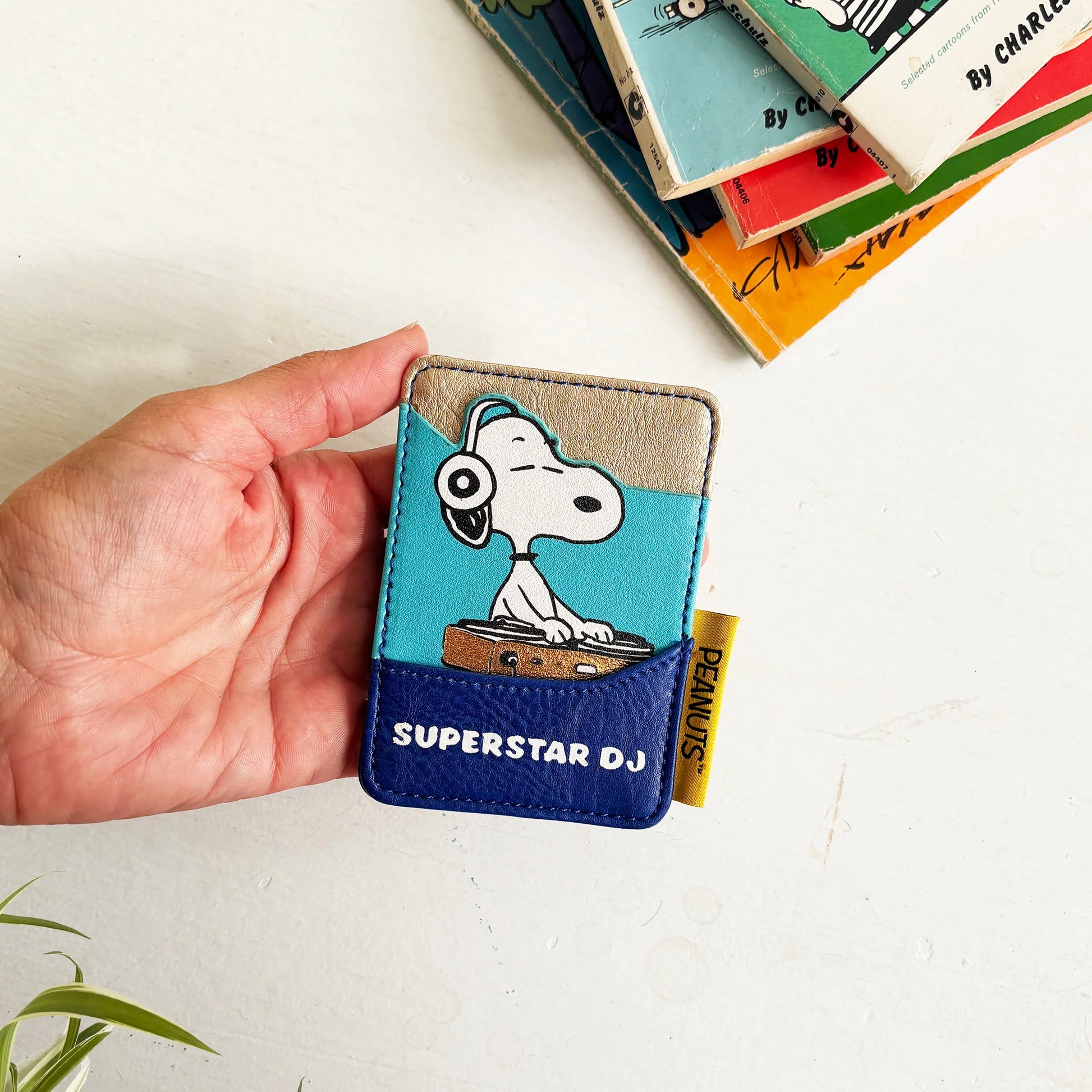 Peanuts Snoopy cardholder held in hand