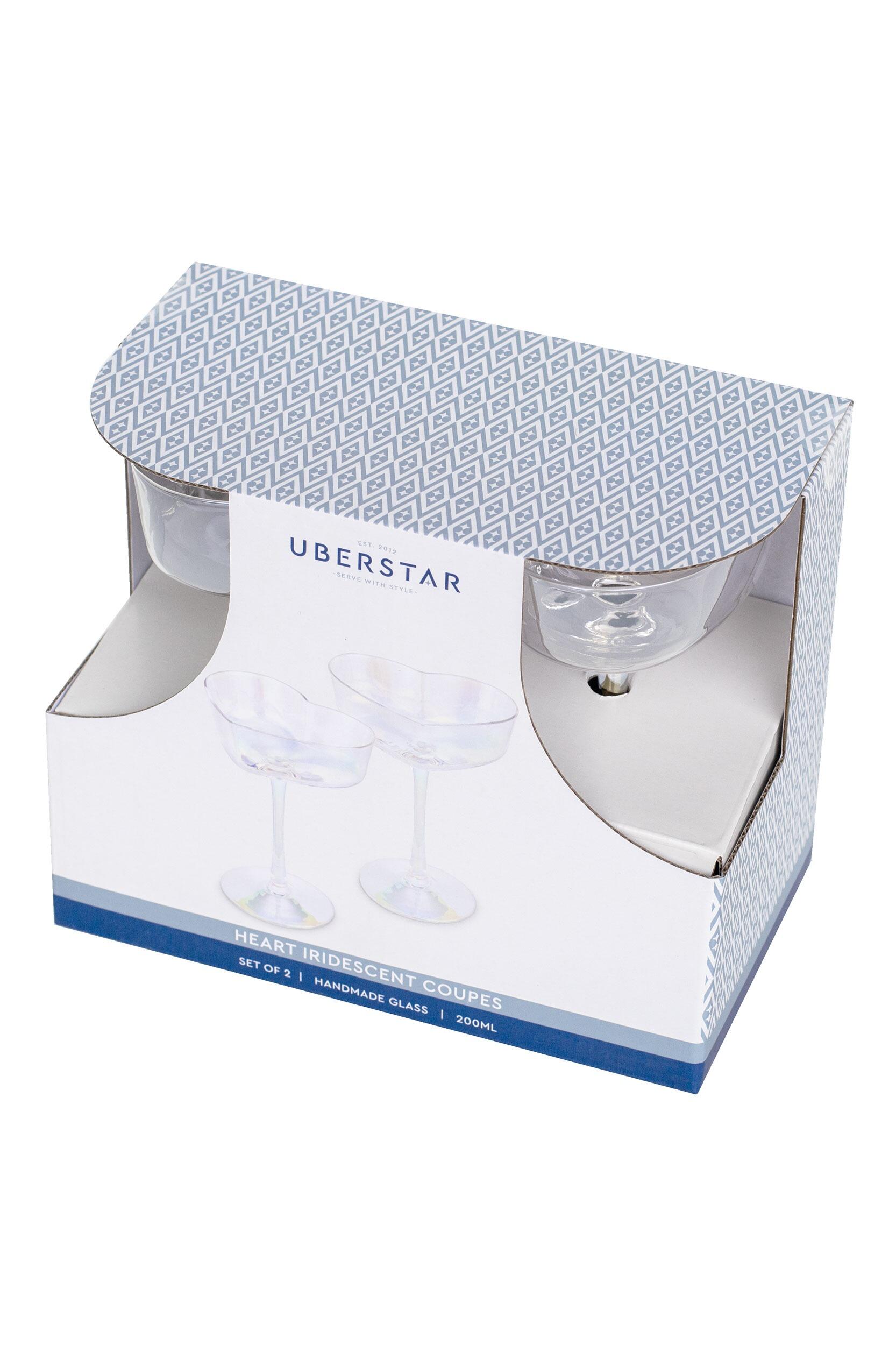 Iridescent heart coupe filled with sparkling wine for a romantic toast