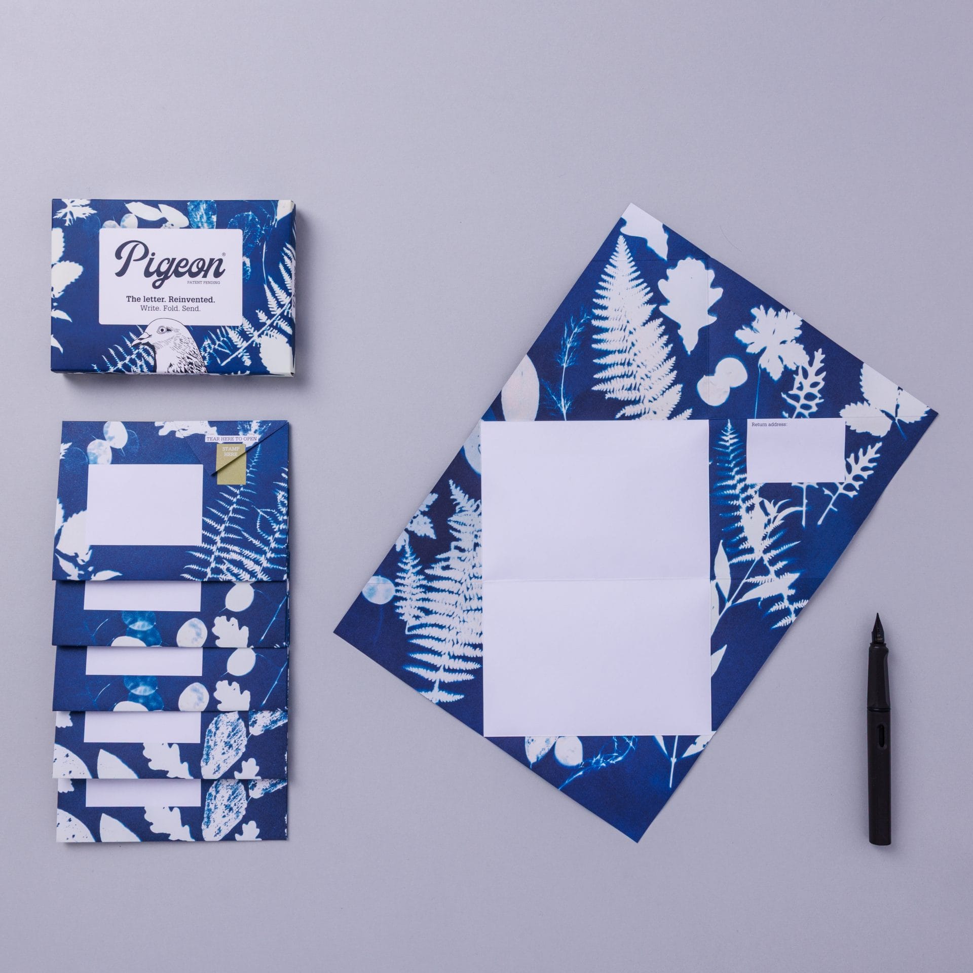 Apothecary Pigeons pack displayed alongside unfolded letter on lavender background