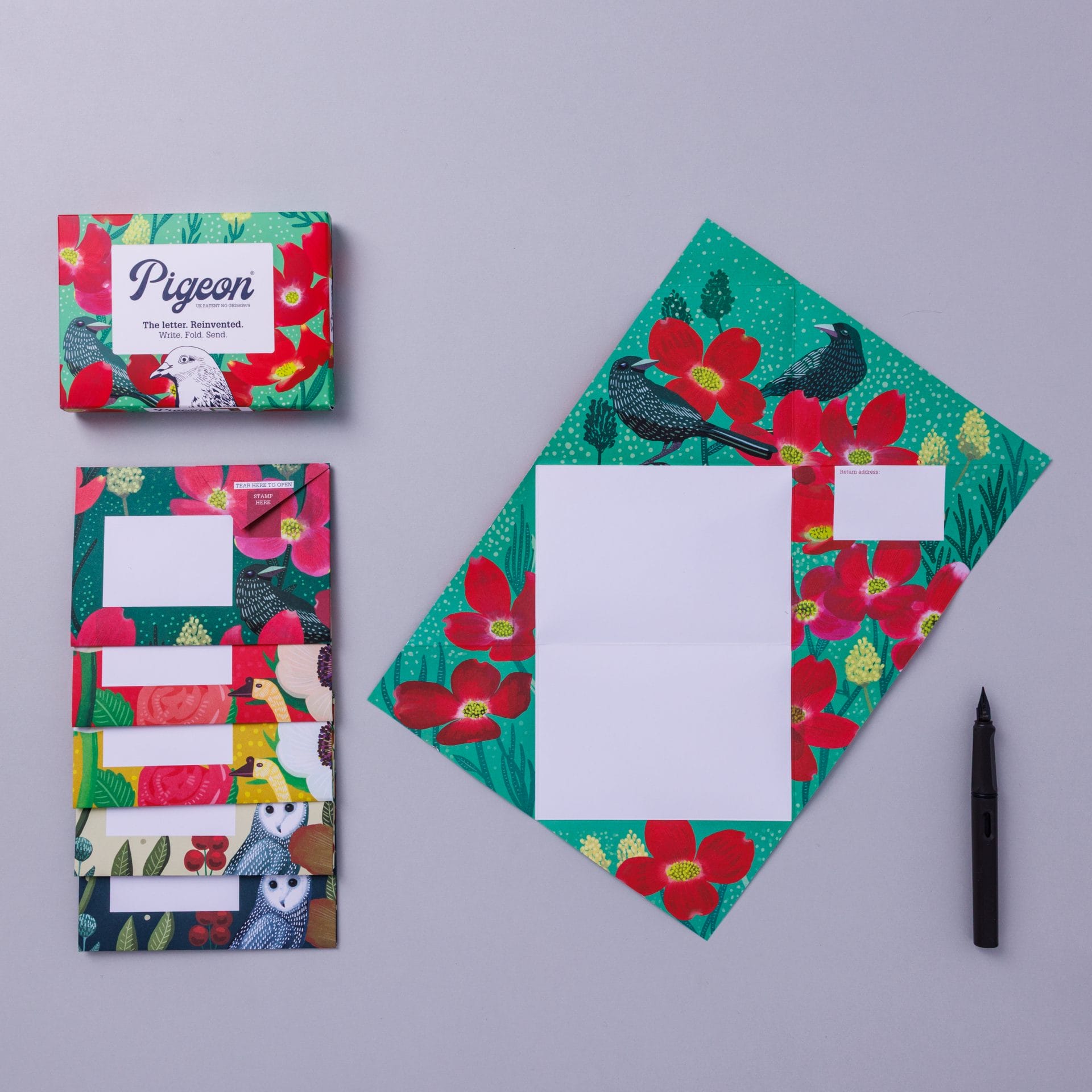 Pack and unfolded Pigeon showing poppy design in warm tones on lavender background