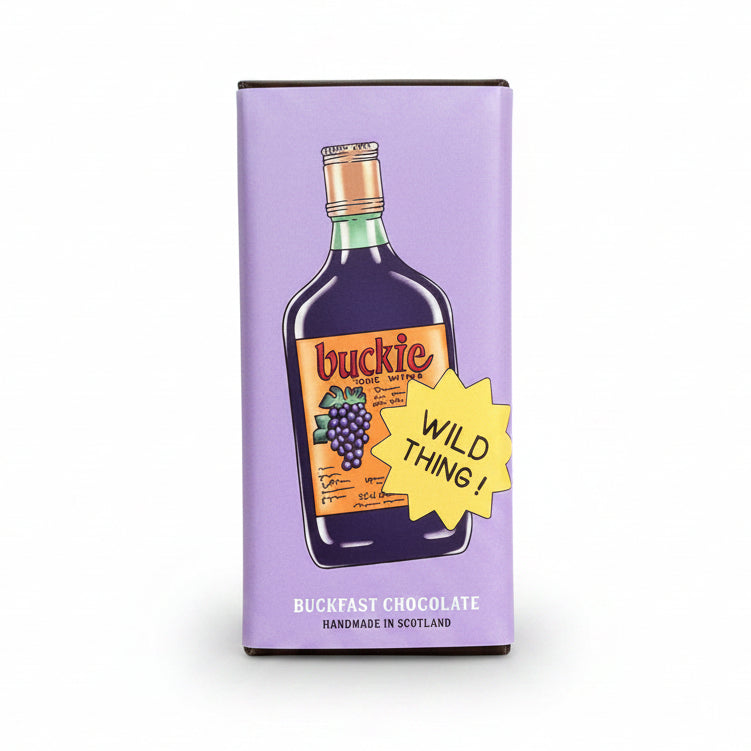 Buckfast chocolate bar in lilac buckie bottle wrapper held against pink graffiti