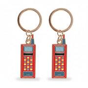 Two red enamel walkie talkie keyrings side by side on white background