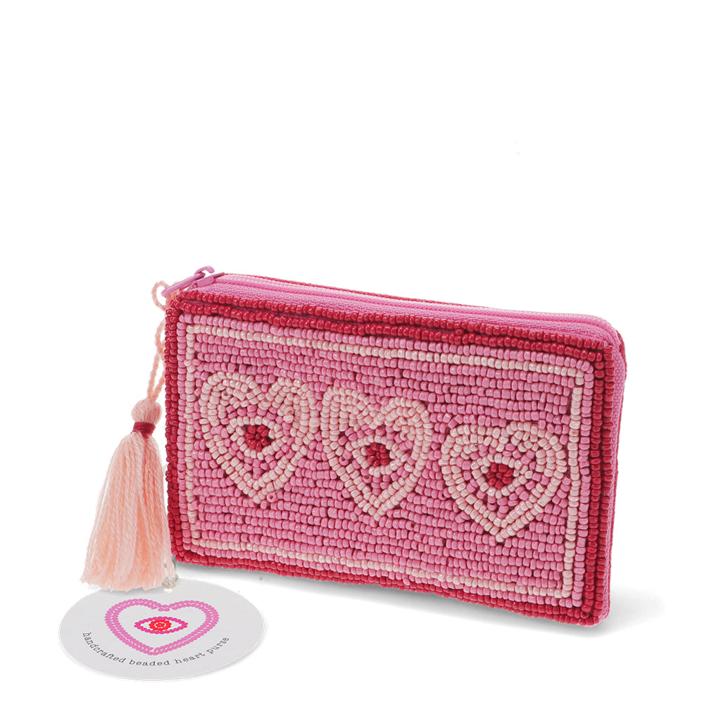 Handcrafted beaded heart purse angled view with tassel and product tag