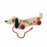 Charlie sausage dog pull toy angled view showing red string on white background