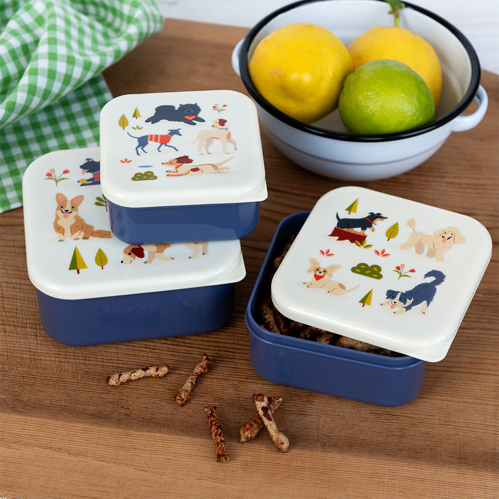 Dog Park snack boxes on a wooden worktop beside a bowl of lemons and limes