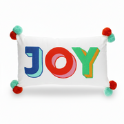 Joy embroidered pom pom cushion front view on grey background