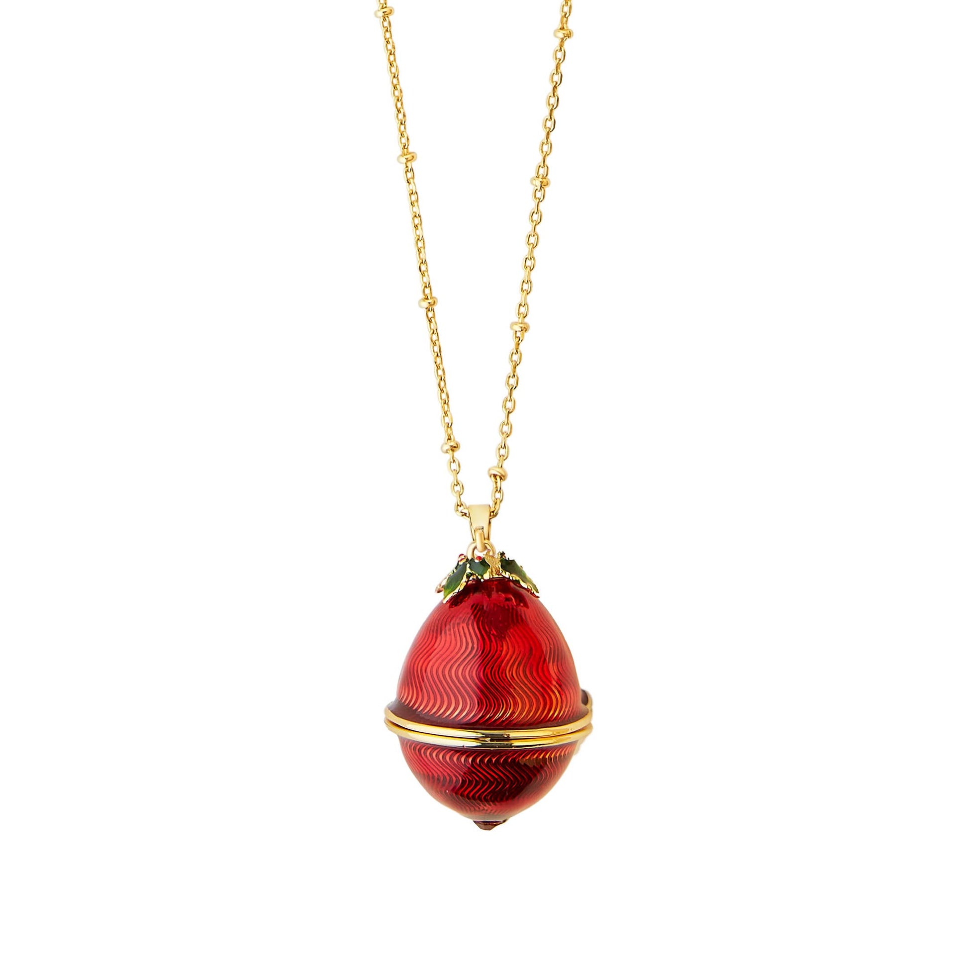 Bill Skinner Robin Egg Locket closed, showing red enamel egg with gold holly leaf detailing on long gold chain.