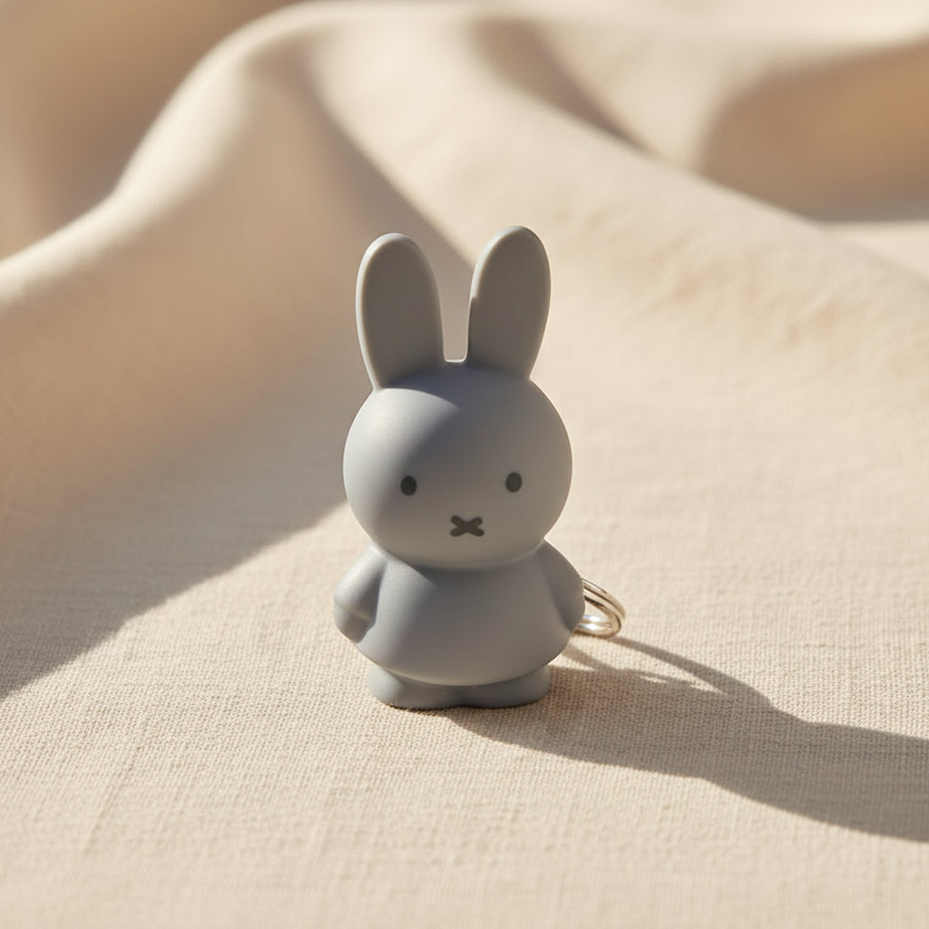 Moulded silver blue Miffy figure with metal split ring, front view
