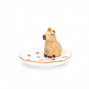 Capybara trinket dish with orange on head on white background front view