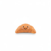 Single croissant token with smiley face on white background front view