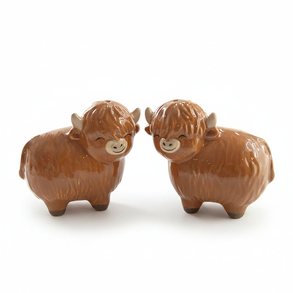 Highland cow salt and pepper shaker pair close-up on white background