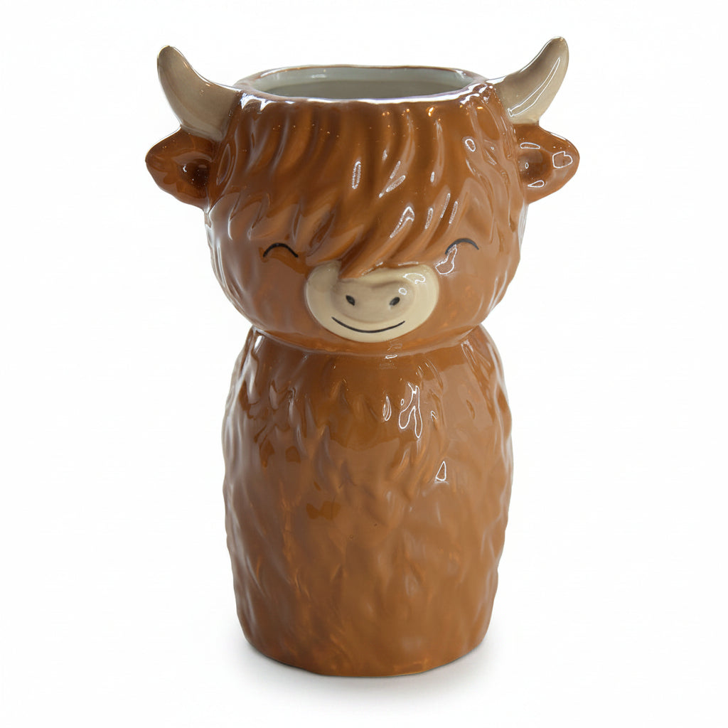 Highland cow shaped ceramic vase front view on neutral background